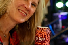 Lady Drinking Dr. Robot at Monday Night's 12th Anniversary, Monday Night Garage, Atlanta, Georgia, 2023.